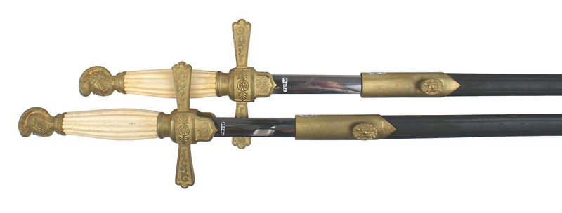 Pair U.S. Militia NCO dress swords circa 1850: K-26 Pair of Militia NCO dress swords. Dull gilt. Knight's helmet pommel and tapered quillons with a linear design and shield shaped langets. Reeded age toned white bone grip. 27 1/2" clean elliptical