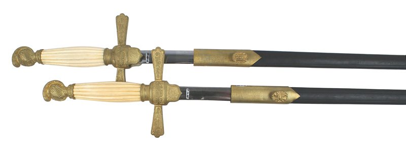 Pair U.S. Militia NCO dress swords circa 1850: K-27 Pair of Militia NCO dress swords. Dull gilt. Knight's helmet pommel and tapered quillons with a linear design and shield shaped langets. Reeded age toned white bone grip. 27 1/2" clean elliptical
