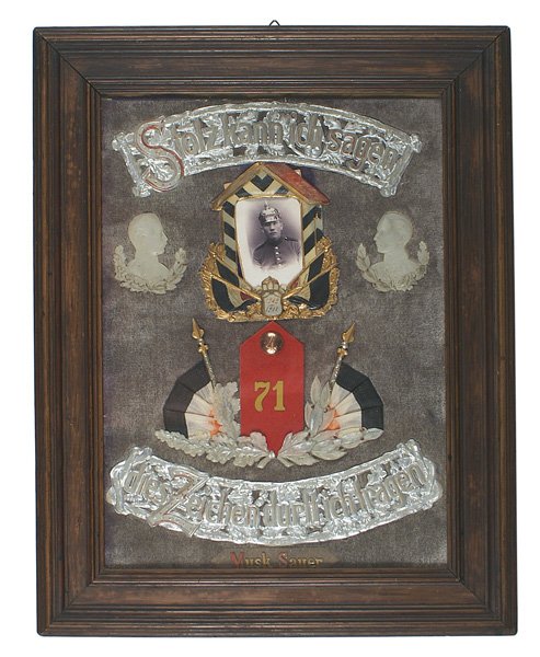 German WWI Commemorative patriotic frame: G-14 Commemorative souvenir patriotic frame of military service. Colored celluloid "guard shack" frame holding a CDV of a helmeted Prussian soldier. Dated 1909-1911. Also an oak leaf national colors c