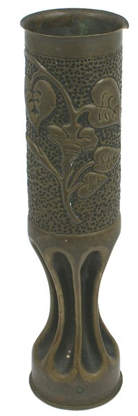U.S. WWI trench art vase: G-33 U.S. WWI "trench art" vase. Embossed floral design on a stippled background with a "pinched" lower area-made from a French 75 MM brass shell casing. Well marked. 13 1/4" tall. II