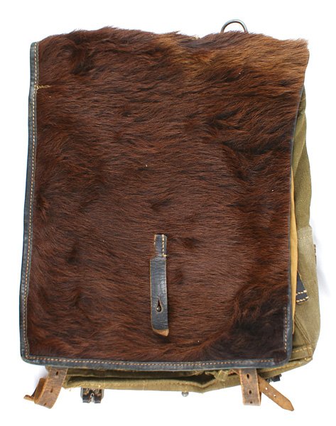 German Army WWII backpack: N-3 German Army WWII backpack. Pony hide covered flap. Complete with straps. Maker marked and dated "1941" ll