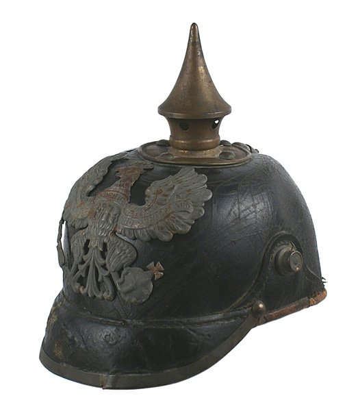 Prussian WWI pickelhaube spike helmet: E-3 Prussian WWI "pickelhaube" Silvered gray eagle frontplate. Round brass base with spike and four domed rivets. Leather well-worn and frayed. Missing rear brim and rear spine. Is bent at base. Leath