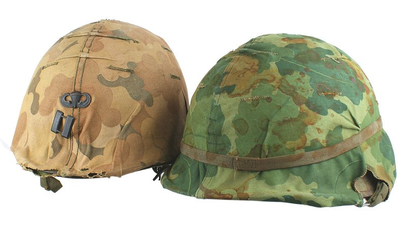 Lot of 2 U.S. Vietnam era helmets: E-61 Lot of 2 Vietnam era U.S. helmets: (1) swivel bale helmet with rusted areas. Cloth camo cover. Composition liner in poor condition. (2) Paratrooper helmet. Correct type web harness. Camo cover ha
