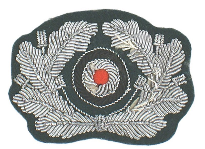 German WWII Army officer cap insignia: E-187 German WWII Army officer relief silver bullion peaked cap wreath/rosette on dark green, with paper backing. I