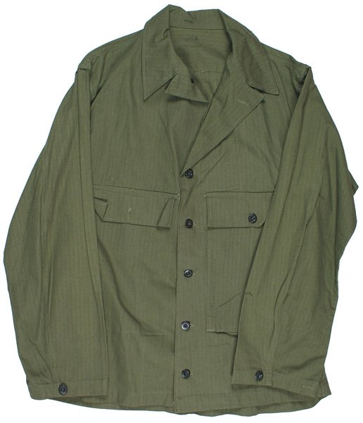 U.S. Army WWII OD HBT tunic: F-63 U.S. Army WWII O.D. HBT tunic. Has one long chest pocket and a flap only for a second pocket. Black iron buttons. Stamped with size "38R". Back is stenciled with the name "C.R.STRUTZ". Like new. 