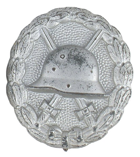 German WWI Wound Badge Silver medal: B-15 German WWI Wound Badge - Silver. Minor wear to dull silver finish on top of helmet. II