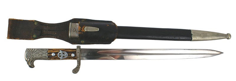 German WWII Police sidearm bayonet dagger: D-16 German WWII Police sidearm. Nickeled detailed eagle head pommel and oak leaf decorated turned-up crossguard. Reverse stamed "S.W.II.209". Police eagle/swastika/wreath insignia affixed to stag gri