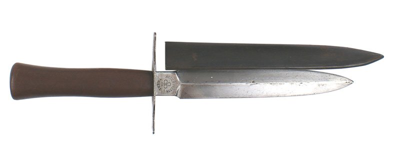 French WWI combat knife: D-42 French WWI combat knife. Round wood grip with a flat crossguard. 6 5/8" double edged clean blade - marked with a 3-leaf clover logo and "ASTIER-PRODON-THIERS" Steel scabbard with a metal belt loo