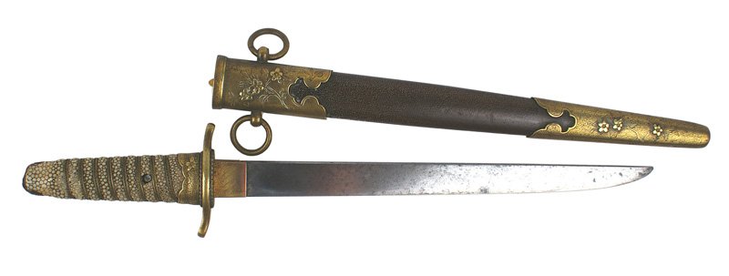 Japanese WWII dress dagger: D-45 Japanese WWII dress dagger. Brass wire wrapped rayskin grip with an applied pawlonia flower. Missing pommel cap. Pawlonia flower decorations on ferrule. Short crossguard. 9 1/8" gray blade. Pawlo