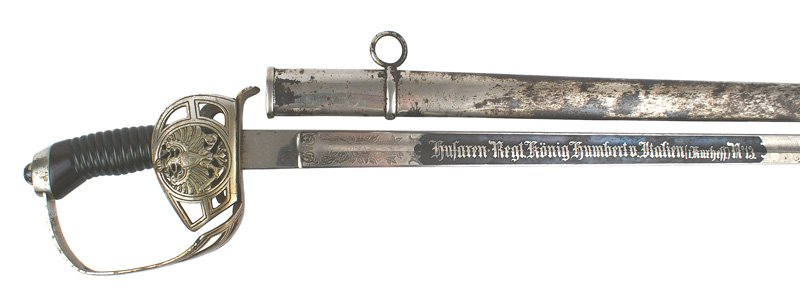 German M1889 13th Hussars dress sword: D-50 M1889 13th Hussars dress sword. Black-horn grip. Nickeled pommel/reverse "D" knuckle-bow and folding open guard bearing a Prussian eagle. Clean 33" straight blade with floral work and a blued pan