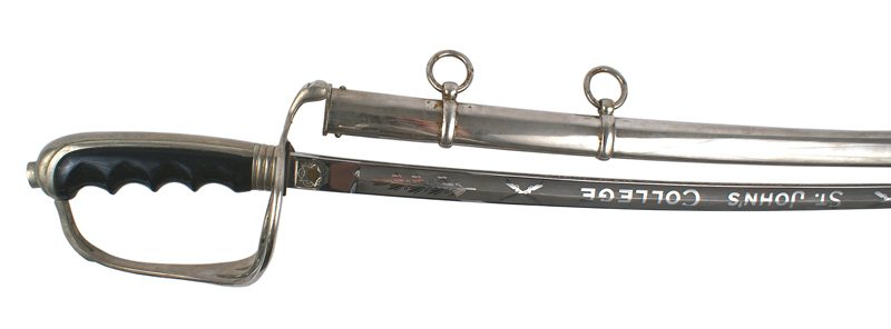 U.S. M1902 dress sword: D-76 U.S. M1902 dress sword. Nickeled backstrap, three-branch guard and two-ring scabbard. Black plastic groove and grip. Excellent 29 5/8" blade etched with crossed rifles, "ST. JOHN'S COLLEGE" and l