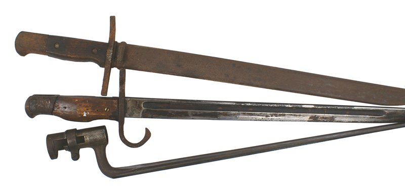 Lot 3 bayonets Japanese and 45-70: D-94 Lot of 3 bayonets: (1) Japanese Arisaka M1897. Nagoya Arsenal marked blade. Field replaced wood grips - blade with hardened cosmoline, fittings rusted. (2) Same - no hooked quillon. Nagoya and ar