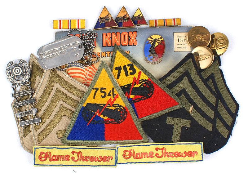 U.S. WWII Tank Battalion Flame Thrower insignia: S-8 Lot of insignia from Tech Sgt. John J. Manning Jr. : (1) Shoulder "patches" - 713th and 754th Tank Battalion with two "Flame Thrower" legends; pair of Summer and Fall Tech. Sgt. chevrons. (2) Pair