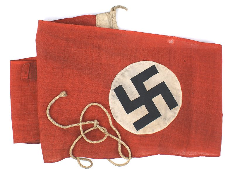 German WWII NSDAP ship type pennant: H-119 N.S.D.A.P. ship's-type pennant. Black printed swastika on a 5 3/4" white disc - sewn on a 11" x 78" red field. The printing on the 2" reinforced border is soiled and not readable. However the 47