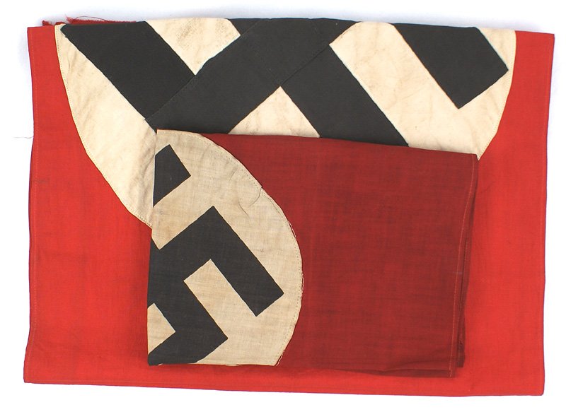 Lot 2 German WWII NSDAP flag pennant: H-132 Lot of 2: (1) N.S.D.A.P. Flag. Black printed swastika on a 8 1/2" diameter white disc - sewn to a red field. 18 1/2" x 26". (2) Wall pennant. Black swastika sewn on a 13 1/2" diameter white disc