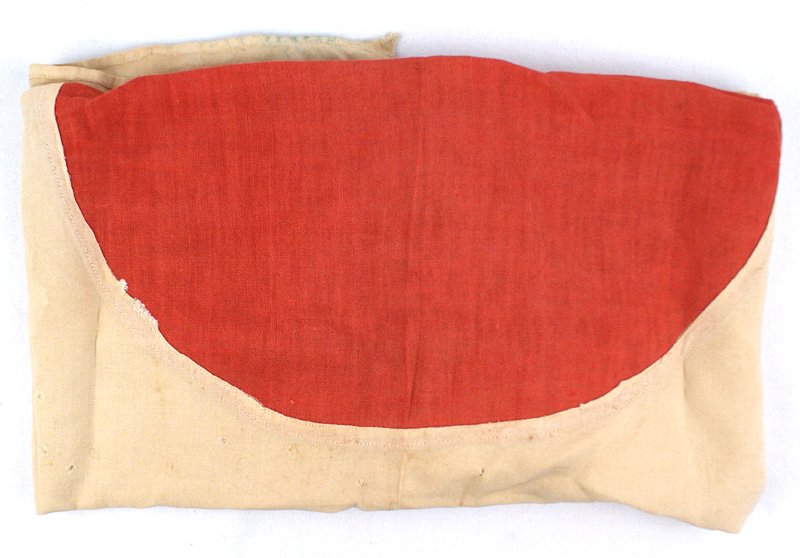 Japanese WWII cotton meatball flag: H-171 Japanese WWII cotton "meatball" flag. Reinforced corners with string ties. Separately sewn red center. White field has discolored from age. A field captured flag. 26 1/2" x 27". About II