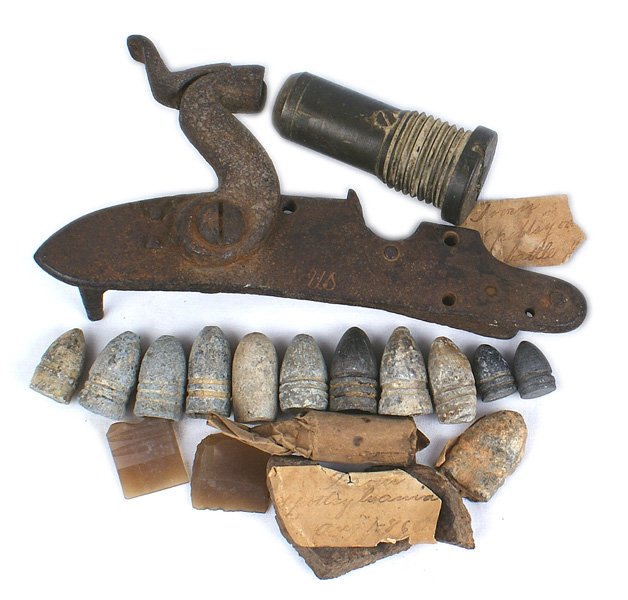 U.S. lot lock plate shell fragment Spotsylvania: M-027 Miscellaneous lot: (1) Lock plate converted from a flint lock to percussion. Partially visible "US", and American eagle and what appears to be "1807". Still attached is the percussion hammer. Ru
