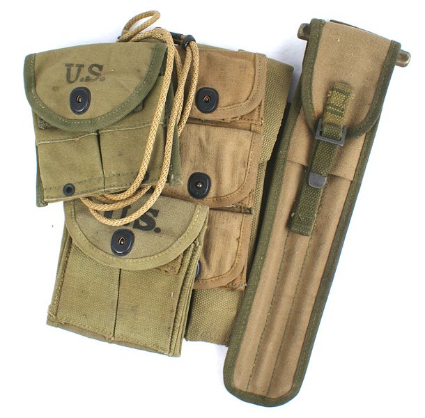 U.S. WWI WWII Lot magazine pouch lanyard: M-050 U.S. Lot: (1) Three-pocket belt pouch. Dated "18". (2) 1918 pattern double 45 cal magazine pouch. Dated "1944". (3) Similar - 1923 pattern. Dated "1943". (4) WWII "U.S.M.C." 3-compartment Thomps