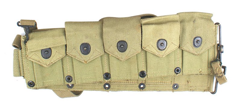 U.S. WWII USMC OD web cartridge belt: M-057 U.S. WWII Marine Corps O.D. web cartridge belt. 10 pocket-type. Reverse marked "U.S.M.C." and maker "BOYT - 43". With attached web suspenders. I