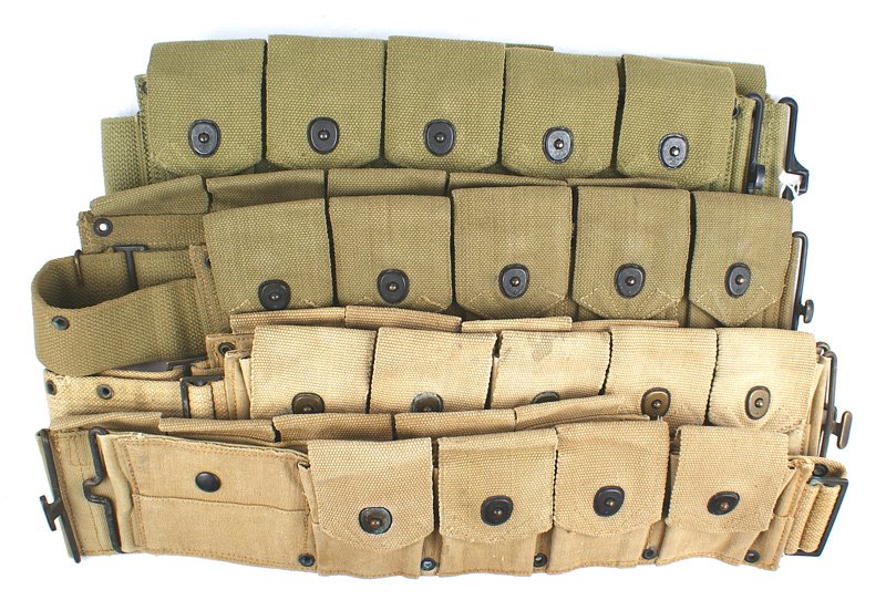Lot of 3 U.S. WWII OD web pouches: M-059 Lot of 3 U.S. WWII O.D. web pouches: (1) Three pocket grenade carrier. Marked "US". With a cloth strap. (2) M1937 web BAR bandolier. Two belt connected 3-pouch sections. Marked "BOYT - 42". Inte