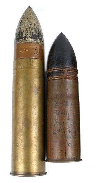 Lot 2 shells Span-Am War Navy shell French WWI: M-069 Lot of two shells: (1) Span-Am War period Navy shell. 5 1/2" "brass casing with a 3 3/4" " steel head-dated "1898". (2) WWI French 37mm shell. Overall height 6 3/8" tall. Casing is engraved "To 