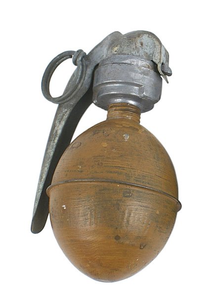 French fragmentation grenade: M-075 French fragmentation grenade. Yellow-tan painted egg shaped tin body. Age toned lightweight metal head/handle with ring. Scarce. II