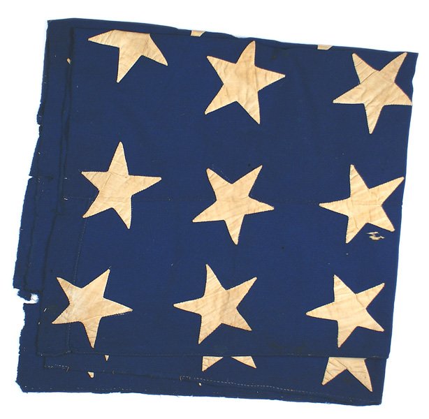U.S. Civil War flag 34 star blue canton: K-177 American Civil War flag cut-out 34 star canton. 37" x 38" blue field with separately hand sewn aged toned white stars. Two sided. With: (1) Typed testimony that this flag canton was flown on a b