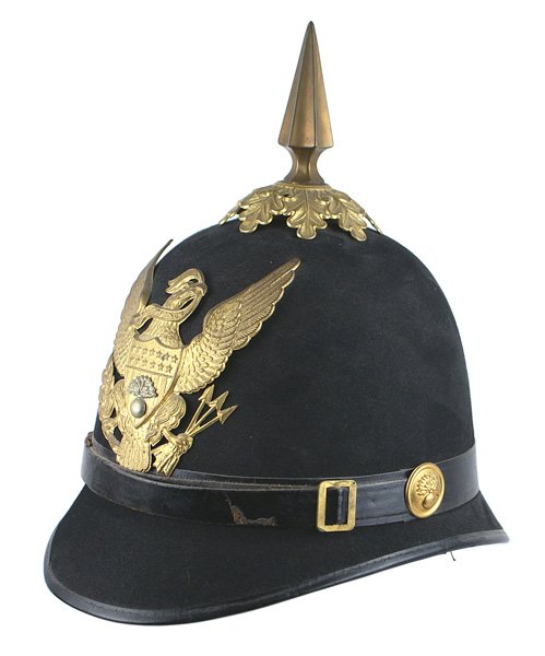 U.S. M1881-1902 EM Ordnance helmet: K-190 U.S. M1881-1902 EM Ordnance Corps helmet. Black felt body. Leather band/chinstrap with gilt-brass "flaming grenade" bosses. Silver "flaming grenade" affixed to the "Peace Eagle"/shield frontplat
