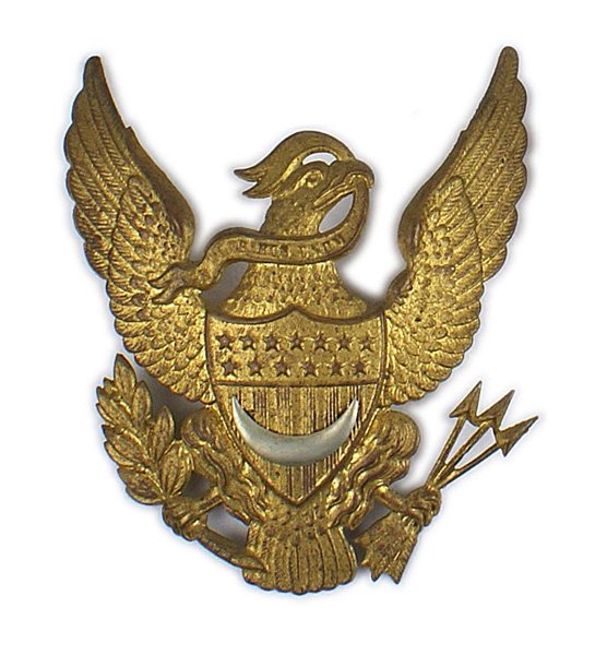 U.S. Commissary M1881 EM helmet plate: K-200 U.S. Commissary M1881 E.M. helmet plate. 4 1/2" x 4 1/4" yellow metal eagle/shield. White metal crescent affixed to shield. Metal loops on reverse. II