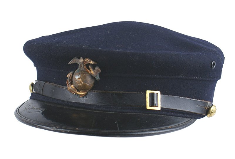 Marine Corps EM M1895 EM undress cap: K-254 Marine Corps E.M. M1895 E.M. "undress cap" - dark blue with black leather visor and chinstrap with gilt-brass eagle/anchor buttons. Side vents. Aged-toned EGA badge. Name "Ernest Lowe" written o