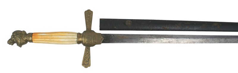 19th Century American/fraternal/patriotic dress sword: K-279 Unidentified late 19th Century American/fraternal/patriotic dress sword. Age-toned reeded bone grip, with a brass knight's helmet/lion pommel. Relief floral designs on the cross guard which has 