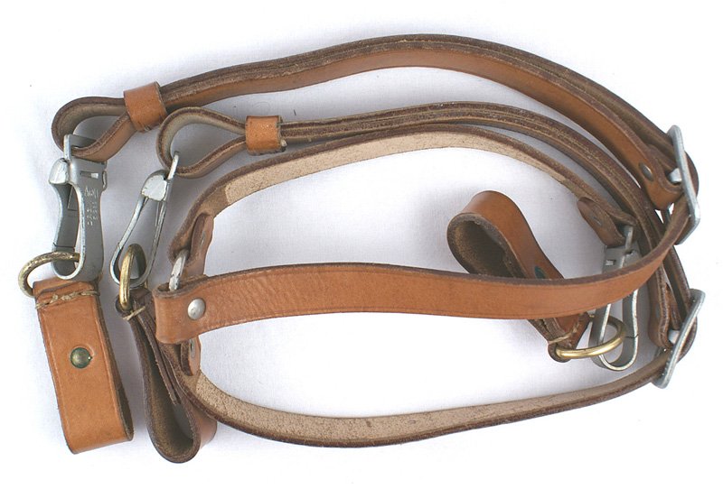 German WWII NSDAP Leader Y straps: N-006 German WWII N.S.D.A.P. Political Leader "Y" straps. Light brown leather. Marked "STOLA WIEN". Pebbled silver snaps marked "RZM, AU" and "DRGM-M5/289". Two matching belt loops with gold "D" rings