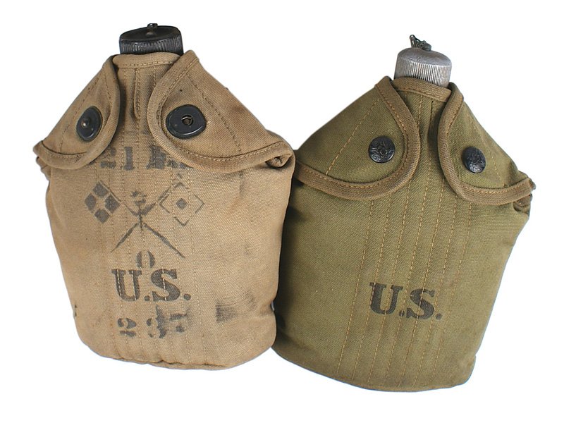 Lot of 2 U.S. WWI canteens: N-033 Lot of 2 U.S. WWI canteens: (1) O.D. cover with American eagle button snaps. Cover is dated "R.I.A. 1914". (2) Snap-type cover. Front is stenciled with crossed signal flags, "321 FB", "US" and "