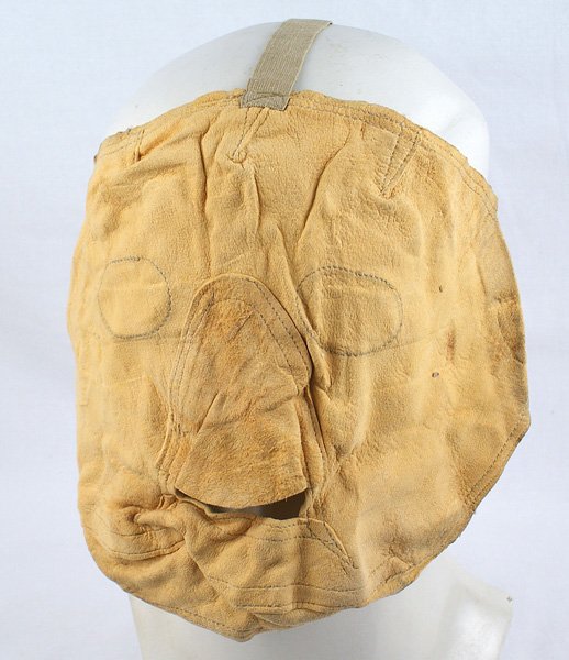 U.S. WWII Mountain Trooper face mask: N-056 U.S. WWII Mountain Trooper's face mask. Chamois material with a cut-out mouth piece and nose cover. Eye openings are marked off but have not been cut. Elastic straps and original 1943 maker's la