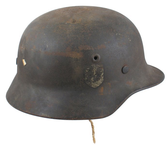 German WWII M1940 Waffen SS single decal helmet: E-037 German WWII M1940 Waffen SS single decal. In untouched field found condition. The SS runes decal is weathered and worn, but still very obvious. The body of the helmet is soiled and the top has s