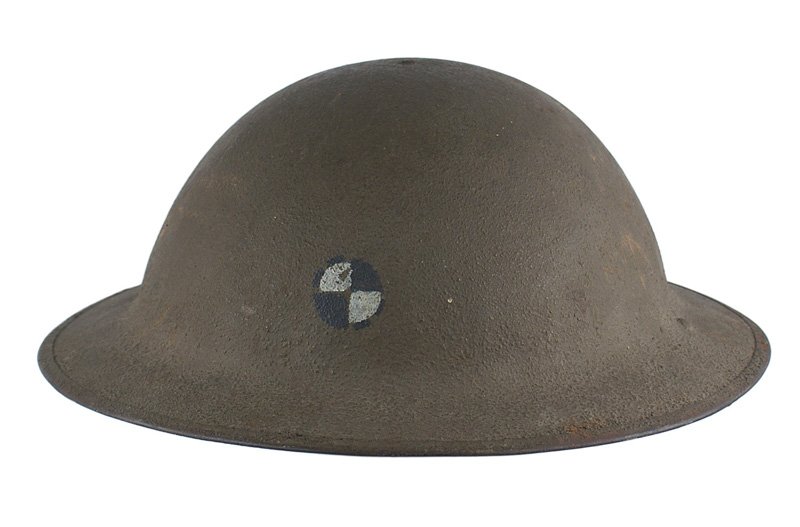 U.S. WWI doughboy 4th Corps painted helmet: E-053 U.S. WWI "doughboy" 4th Corps "painted" helmet. O.D. sand finish with a black circle with 2 white quadrants on the front. Leather chinstrap and liner show some use. II