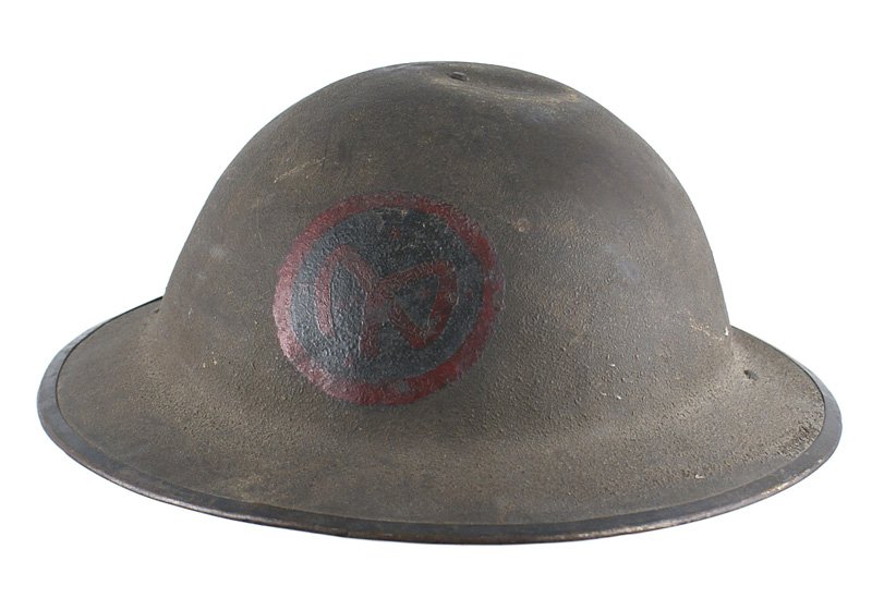 U.S. WWI doughboy 27th Division painted helmet: E-062 U.S. WWI "doughboy" 27th Division "painted" helmet. O.D. sand finish with a red "NY" monogram on a black disc with a red border on the front. Leather chinstrap and liner show some use. Painted u