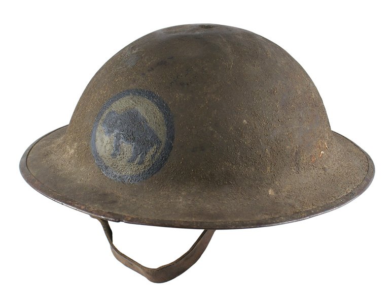 U.S. WWI doughboy 92nd Division painted helmet: E-075 U.S. WWI "doughboy" 92nd Division "painted" helmet. O.D. sand finish with a black buffalo, on an O.D. disc with a black border on the front. Several small dents on top. Leather chinstrap and lin