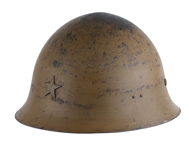 Japanese WWII Army helmet: E-115 Japanese WWII Army helmet. Worn patch on top of the O.D. finish. Star affixed to front. Three-section, double tongue leather liner. With O.D. chin ties. About II