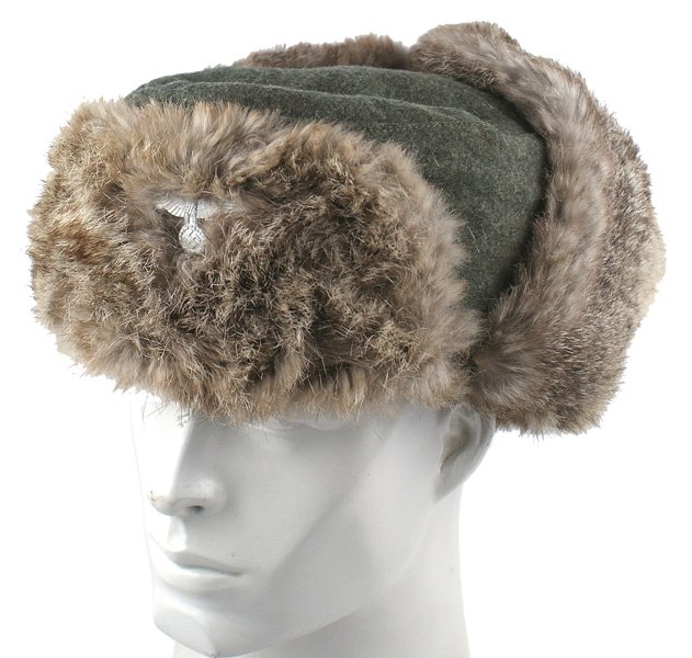 German WWII Army winter hat: E-187 German WWII Army winter hat. Padded lining is maker marked "Hons Iglau" and dated "1942". II+