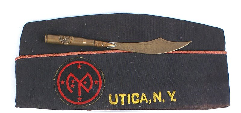 U.S. WWI Veteran o'seas cap: E-210 U.S. WWI veteran's o'seas cap. Yellow-gold embroidered "POST 56 27TH DIVISION - UTICA, NY". Sewn on embroidered 27th shoulder patch and a period machine gun badge with "US" pinned on front. Also