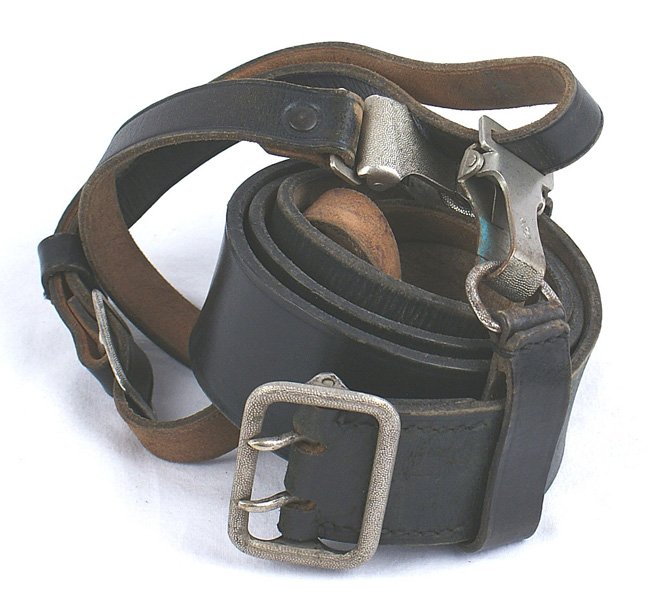 German WWII SS belt and cross strap: F-162 German WWII SS belt and cross strap. 1 3/4" wide 35" black leather belt is stamped with SS runes and "RZM L2/1638/38". Silver pebbled, 2-prong open buckle is marked "RZM Md/93" and company logo.