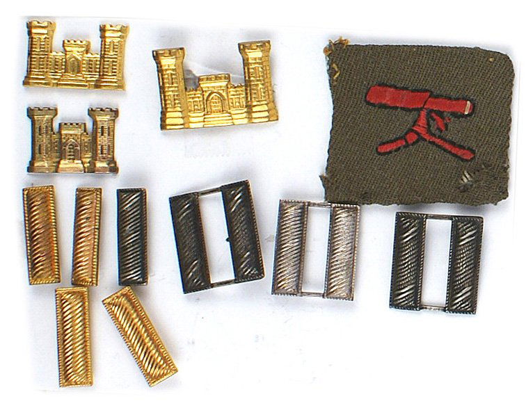 Lot of U.S. WWI Machine Gunner patch etc: F-199 Lot of U.S. insignia: (1) WWI Machine Gunner's patch. (2) Three gilt Engineer's badges, pair of Captain bars, two pairs of 1st Lieutenant bars and single 2nd Lt. Captain. II