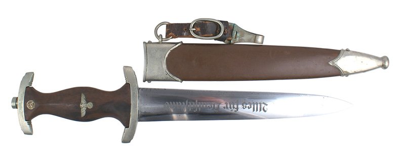 German WWII SA dagger: D-002 German WWII SA dagger. Darkened patina on the top and lower crossguard. Marked "Wf" (Westfallen). Some small light spotting. Reverse has the maker's logo and "CARL SCHMIDT SOHN A.G. - SOLINGEN".