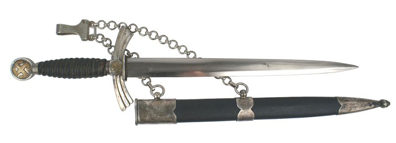German WWII Luftwaffe 1st Model dagger: D-014 German WWII Luftwaffe 1st Model dagger. Gilt brass "sun-wheel" swastika discs in pommel and winged crossguard. Wire wrapped dark blue grip. Excellent 12 1/4" blade marked with rare maker logo "F
