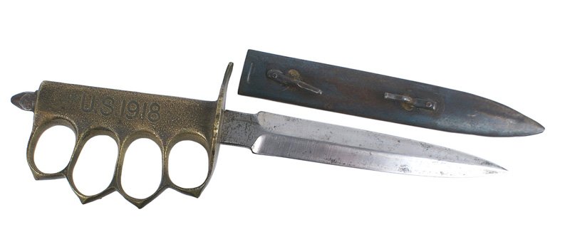 French made U.S. WWI MARK I trench knife: D-060 French made U.S. WWI MARK I trench knife. One-piece cast handle/brass knuckles/round crossguard. Marked "U.S. 1918". Steel pointed pommel attached. 6 1/2" double-edged bright blade (starting to 