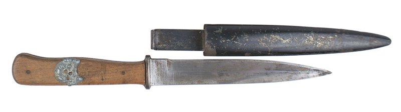 German WWII boot knife: D-063 German WWII boot knife. 5 7/8" unmarked blade. Shows some wear and is graying. Wood grips have an attached aged Panzer collar-tab skull. Black finish on steel scabbard is scratched. Steel spring