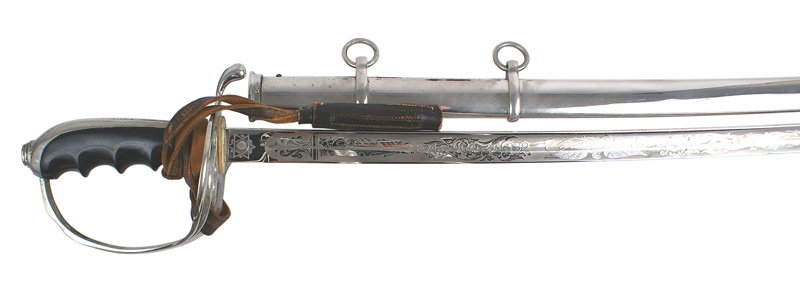 U.S. Army M1902 officer dress sword: D-100 U.S. Army M1902 officer's dress sword with a black bakelite grip. 32" excellent blade. Maker's logo and "WM WORSTMANN...PHILDEPHIA". Scabbard as above with leather portopee. WWII era. II+