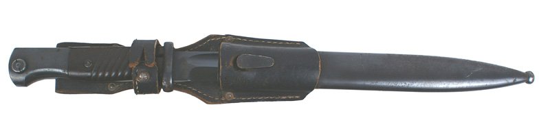 German WWII Mauser K98 bayonet: D-109 German WWII Mauser K-98 bayonet - bakelite grips. Blued steel pommel and crossguard. 99% blued excellent blade - marked "W.K.C.". Blued scabbard with some scattered light rust dimples. Black lea