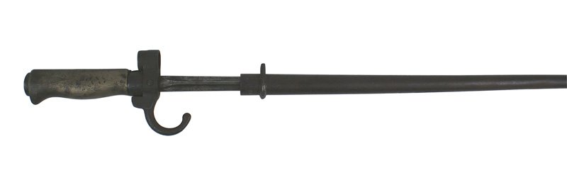 French M1886 Epee bayonet: D-137 French M1886 Epee bayonet. White brass grip and round press stud. Dark spots on the cruciform blade and age darkened scabbard. II-